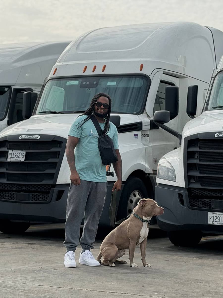 Driver with his dog in front of the fleet — Eastwind is pet friendly